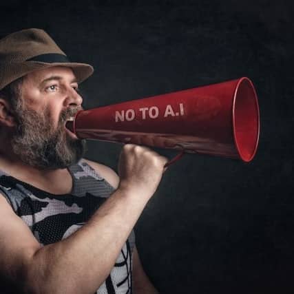 Man holding megaphone with the text "NO TO AI" printed on the side. Stock image from https://www.pexels.com/photo/man-protesting-ai-with-red-megaphone-37005337/